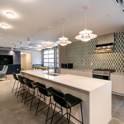 The Backyard at One North apartments community kitchen and entertainment space