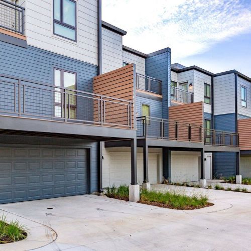 Westside Flats townhomes exterior with parking