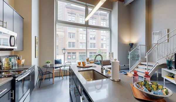 Roaster's Block apartment interior with open kitchen and high ceilings