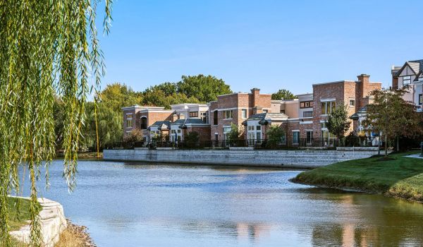 Mission 106 Apartments property exterior with large lake