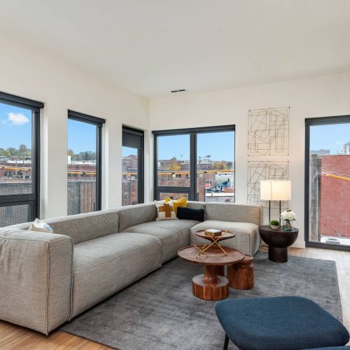 Arterra apartment interior featuring living room with large windows