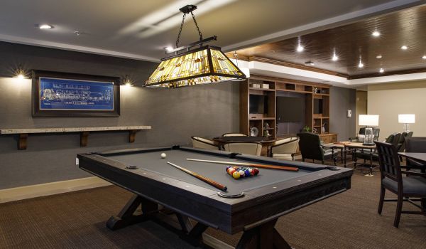 Avenue 81 apartment community billiards and game room