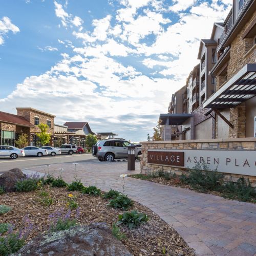 The Village at Aspen Place front sign and parking