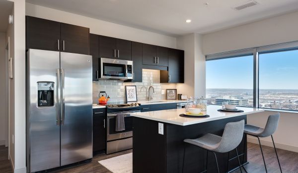 Commerce Tower apartment kitchen with large windows