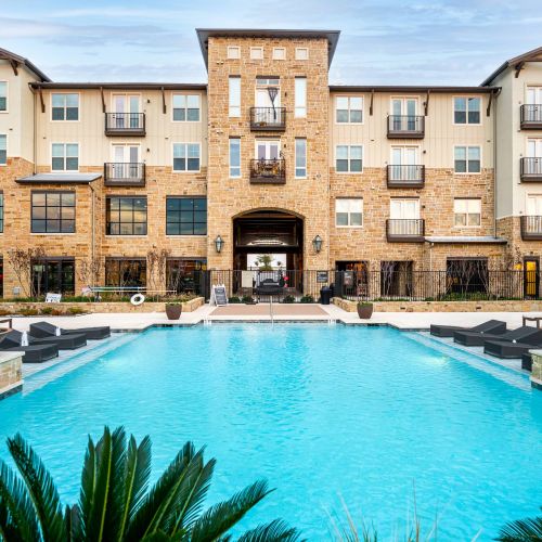 The Village at Rayzor Ranch building exterior with luxury pool