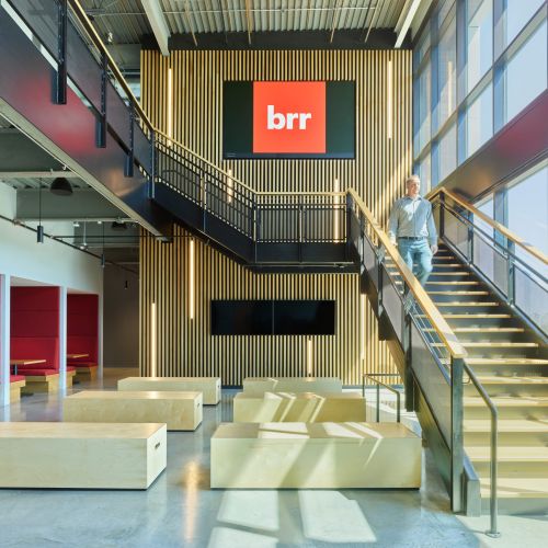 Avenue 82 interior lobby with two stories and staircase