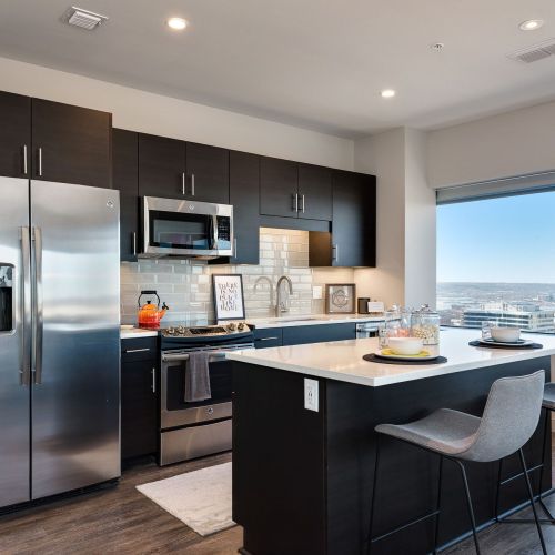 Commerce Tower apartment kitchen with large windows