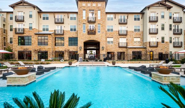 The Village at Rayzor Ranch building exterior with luxury pool