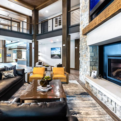 Wheatfield Village apartments community lounge with fireplace