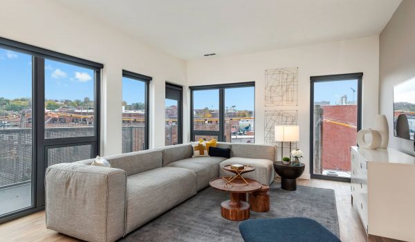 Arterra apartment interior featuring living room with large windows